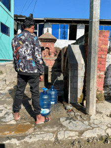 Refilling water jugs in Banepa