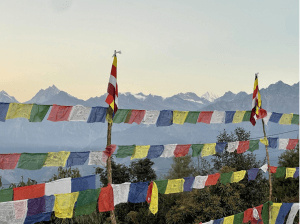 Prayer flags at the mountaintop, with a view of the Himalayan mountains (Photo Credit: Jennifer Morash)