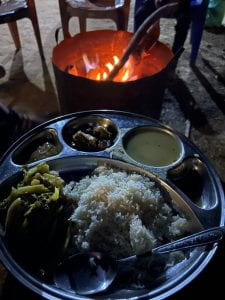 Dal bhat dinner by the campfire at Sanskriti farms. This traditional Nepali dish of lentils, rice, and vegetables is said to power the nation.